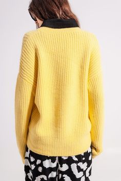 This vibrant yellow sweater boasts of a cozy, relaxed fit, a fabulous chunky ribbed knit with rib trims, drop shoulders, and a crew neckline. We love the look of this sweater with our Relaxed Trousers in Monotone Animal Print, as shown in our photos. The fabric is 77% Acrylic, 20% Polyamide, and 3% Elastane. The model is 5’7” with measurements of 29-23-34 and is wearing a size small. Sizes of S-M-L equates to US sizes of 4, 6, and 8 respectively. Yellow Jumper, Tan Scarf, Rib Knit Sweater, Relaxed Trousers, Online Fashion Boutique, Yellow Sweater, Scarf Hat, Ribbed Knit Sweater, Affordable Clothes