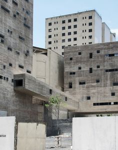 the building is made of concrete and has many windows