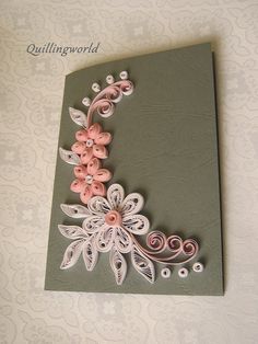 a greeting card with flowers and swirls on the front, handmade by quillingworld