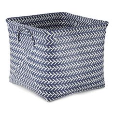 a large blue and white basket with an interesting pattern on the front, it has a zippered closure