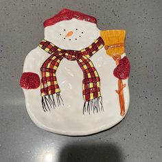 a white plate with a snowman on it