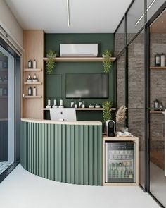 a green and white kitchen with an ice cream bar in the middle, surrounded by glass doors