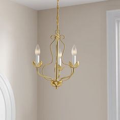 a chandelier hanging from the ceiling in a room with beige walls and white trim