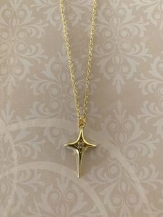 "Simple, yet elegant and stunning smooth gold tone north star necklace with center rhinestone accent, north star necklace, gold north star necklace, north star necklace, north star jewelry, north star pendant, gold star necklace, star necklace, star necklace gold Pendant measures 1 1/8\" L X 3/4\" W and is on an 18\" chain. ★ Want to see more?  Please visit my shop at: https://www.etsy.com/shop/DesignsByPeg" Star Jewelry Gold, Afro Jewelry, North Star Pendant, Gold Star Necklace, Diamond Star Necklace, North Star Necklace, Pretty Jewelry Necklaces, Star Necklace Gold, Necklace Star