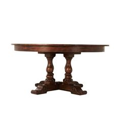 an oval wooden table with two pedestals on each end and one leg at the base