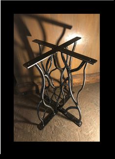 two metal tables sitting on top of a wooden floor