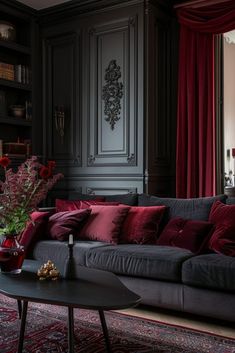 a living room filled with furniture and red curtains