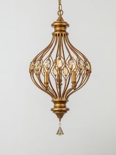 a gold chandelier hanging from the ceiling with crystal beads and crystals on it