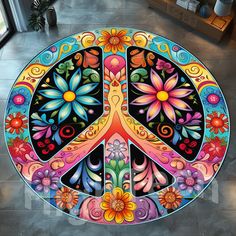 a peace sign painted on the ground with flowers