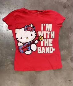 Hello Kitty Rockstar I  m With The Band Shirt Outfit  Shirt Outfit Idea Easy 30 day return policy Outfit Ideas Band Tees, Hello Kitty Tees, Outfits With Band Tees, Cute Thrift Finds, Union Jack Outfit, Pop Culture Cotton Top With Band Logo, Red Band Logo Graphic Tee, Red Graphic Tee With Band Logo, Red Short Sleeve Tops With Band Logo