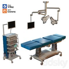 an operating room with two monitors and medical equipment