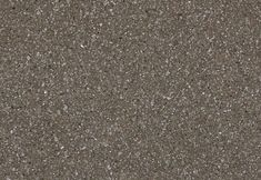 a close up view of the surface of a concrete floor with small speckles