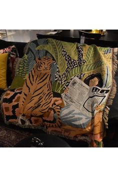 an animal themed throw blanket on a couch