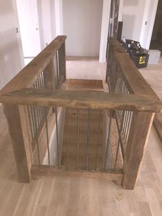 a wooden staircase with metal railings in a house