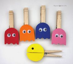 some clothes pins with eyes and faces on them