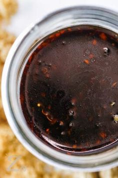 a jar filled with food sitting on top of a table