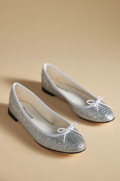 The Cendrillon Ballet Flats by Repetto showcase classic details like a round toe and bow accent, elevated by a glitter finish for added charm. | Cendrillon Ballet Flats by Repetto in Silver, Women's, Size: 37/7, Leather at Anthropologie Repetto Flats, Glitter Flats, Suede Ballet Flats, Brown Flats, Black Ballet Flats, Blue Flats, Ballet Flats, Anthropologie, Ballet