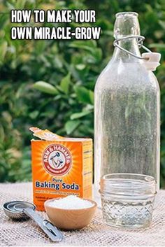 a bottle and spoon sitting on top of a table next to an empty glass jar