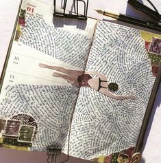 an open book with writing on it next to a pair of scissors and a pen