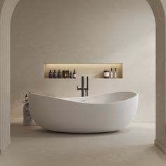 a large white bath tub sitting in a bathroom next to a shelf with bottles on it