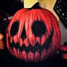 a carved pumpkin sitting on top of a table