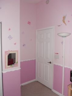 a room with pink walls and white doors, decorated in fairy land decorations on the wall