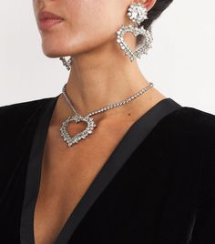 Find ALESSANDRA RICH Crystal Heart Clip-on Earrings on Editorialist. The gleeful feeling of getting ready for an evening out inspired Alessandra Rich to create her namesake label, a brand that fearlessly celebrates femininity. Large jewels and unabashed designs are a given, which is exactly what the Crystal Heart earrings bring to the table, acting as a final touch to complete any eveningwear ensemble. Sterling Silver Heart Jewelry For Party, Heart Pendant Diamond Jewelry For Party, Diamond Heart Pendant Jewelry For Party, Diamond Heart Pendant For Party, Heart Cut Charm Jewelry For Party, Heart Cut Jewelry With Heart Charm For Party, Single Earring For Valentine's Day Party, Dazzling Jewelry For Valentine's Day Party, Party Jewelry With Heart Cut Charm