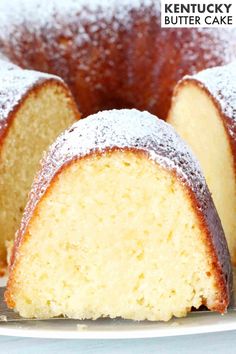 a bundt cake with powdered sugar on top and one slice cut from it