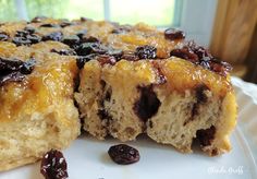 a close up of a cake on a plate with raisins