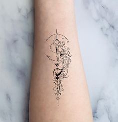 a woman's arm with a tattoo design on the left side of her leg