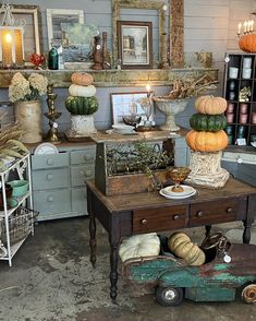 a room filled with lots of different types of pumpkins on top of each other