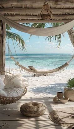 a hammock hanging from the ceiling over a beach