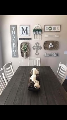 a dining room table with white chairs and pictures on the wall above it that says my first farmhouse gallery wall love it