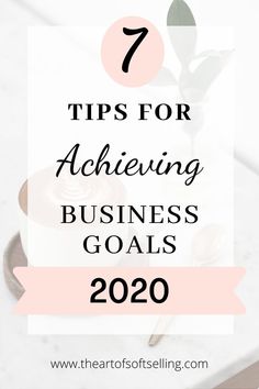 a white table with pink flowers and the words 7 tips for achieving business goals in 2020