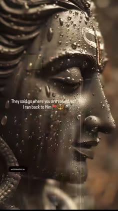 a statue with water drops on its face and the words, they said go where you are