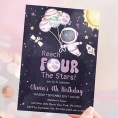 a person holding up a card that says reach four the stars with an astronaut on it