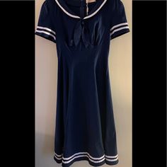 Cute Sailor Dress Retro Navy Dress For Spring, Navy Retro Summer Dress, Blue Sailor Summer Dresses, Sailor Style Blue Summer Dresses, Blue Sailor Style Summer Dresses, Spring Sailor-style Short Sleeve Dresses, Sailor Style Short Sleeve Fitted Dress, Fitted Sailor Dress With Short Sleeves, Blue Marine Style Summer Dress