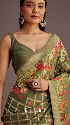 Add a touch of artistry to mehendi, festive gatherings, and cultural celebrations with this mehendi green Georgette saree.
Adorned with intricate jaal work and vibrant multicolor animal and bird motifs, this masterpiece beautifully blends tradition with creativity.
Its lightweight drape makes it perfect for long celebrations while exuding elegance and charm. Indian Fashion Saree, Indian Fashion