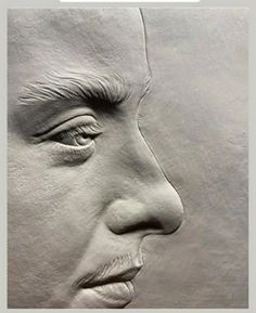 an image of a man's face made out of clay