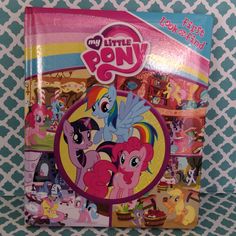 the little pony book is sitting on a table