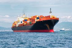 a large cargo ship sailing in the ocean