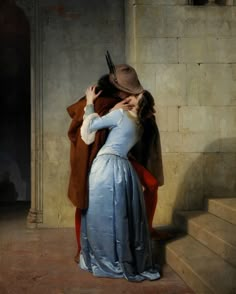 a painting of two people embracing each other