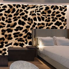 a bedroom with a leopard print on the wall