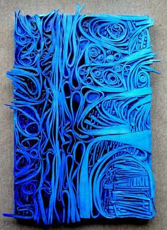 an intricately designed piece of blue paper