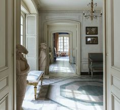 the hallway is clean and ready for guests to use it as an entrance way in this house