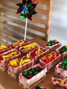 several baskets filled with candy sitting on top of a table next to a pinwheel