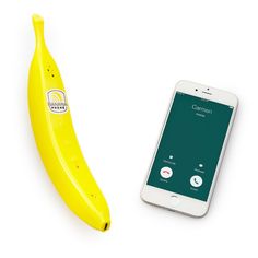 a banana sitting next to a cell phone