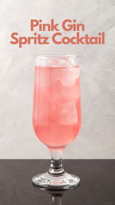 a pink gin spritz cocktail in a wine glass with the words pink gin spritz cocktail