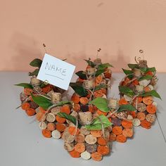 a bunch of wine corks are arranged in the shape of a heart with a sign on top