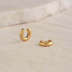 A stylish pair of chunky huggie earrings, crafted from gold vermeil. Perfect for dressier occasions or effortless on-the-go style. 


Inner diameter: 7mm

Outer diameter: 15mm

Width: 4mm 

Lever back closure

If you prefer a post back closure, check out our Chunky Huggie Hoop Earrings - Giulia Puffy Heart Necklace, Gold Huggies, Mother Jewelry, London Blue Topaz Ring, Ring Bag, Best Gifts For Her, Stacked Jewelry, Solid Gold Jewelry, Huggie Earrings